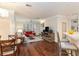 Bright living room featuring hardwood floors, a fireplace, plantation shutters and neutral paint at 2400 Cumberland Se Pkwy # 613, Atlanta, GA 30339
