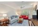 Inviting living room showcasing hardwood flooring, neutral paint, and a cozy sitting area with natural light at 2400 Cumberland Se Pkwy # 613, Atlanta, GA 30339