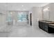 Bright bathroom featuring a freestanding tub, marble floors, and a glass shower with a rain shower head at 2756 Octavia Ln, Marietta, GA 30062