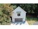 Charming detached garage with white siding, and a window, providing ample space for parking and storage at 2756 Octavia Ln, Marietta, GA 30062