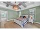 Serene bedroom with wood floors, designer light fixture, and ensuite bathroom with standalone tub at 2756 Octavia Ln, Marietta, GA 30062