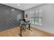 Home office with a statement wood accent wall, hardwood floors, and natural light at 2756 Octavia Ln, Marietta, GA 30062