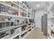 Spacious pantry with ample shelving, counter space, and a stainless-steel refrigerator at 2756 Octavia Ln, Marietta, GA 30062