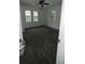 Bright bedroom features wood floors, two windows and ceiling fan at 4 Ivy St, Porterdale, GA 30014