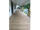 Spacious wooden porch with railing at 4 Ivy St, Porterdale, GA 30014