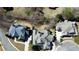 A bird's-eye view showcases the rooftops of several grand houses surrounded by mature trees and manicured lawns at 5352 Lacosta Ln, Alpharetta, GA 30022