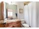 Well-appointed bathroom featuring a granite vanity, classic fixtures, and a shower-tub combination at 5352 Lacosta Ln, Alpharetta, GA 30022