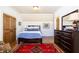 Inviting bedroom with hardwood floors, a bright window, and an ornate area rug creating a cozy space at 5352 Lacosta Ln, Alpharetta, GA 30022
