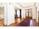 Spacious foyer with hardwood floors, double doors, and dining room entrance at 5352 Lacosta Ln, Alpharetta, GA 30022