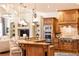 Open-concept kitchen featuring granite countertops, custom cabinets, and stainless steel appliances blends style and functionality at 5352 Lacosta Ln, Alpharetta, GA 30022