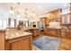 A grand kitchen, with custom cabinetry, granite countertops, and stainless steel appliances, showcases impeccable design at 5352 Lacosta Ln, Alpharetta, GA 30022
