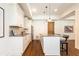 Basement kitchenette features white cabinets, granite countertops, and modern stainless appliances at 5352 Lacosta Ln, Alpharetta, GA 30022