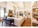 Open-concept living room features a stone fireplace, custom built-ins, and high ceilings, providing elegance and comfort at 5352 Lacosta Ln, Alpharetta, GA 30022