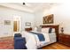 Bright main bedroom with a sitting area, tray ceilings, fireplace, and stylish decor at 5352 Lacosta Ln, Alpharetta, GA 30022