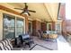 Spacious outdoor porch with outdoor seating, grill, and ceiling fans at 5352 Lacosta Ln, Alpharetta, GA 30022