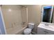 Cozy bathroom featuring a standard tub-shower, toilet, and vanity with sink and mirror at 5517 Green Wing Ct, Lithonia, GA 30058
