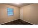 Comfortable bedroom with carpet, neutral paint, a closet, and natural light from a large window at 5517 Green Wing Ct, Lithonia, GA 30058
