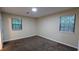 Cozy bedroom with soft carpet, neutral paint, ample natural light, and a minimalist aesthetic at 5517 Green Wing Ct, Lithonia, GA 30058