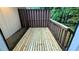 An outdoor wooden deck with a railing and space for seating and entertaining at 5517 Green Wing Ct, Lithonia, GA 30058