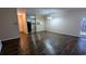 Living room featuring hardwood floors, access to the kitchen, a dining area, neutral paint, and natural light at 5517 Green Wing Ct, Lithonia, GA 30058