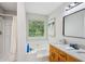 Bathroom highlighting double sinks, granite countertops, a soaking tub, and a separate shower at 835 Navajo Trl, Covington, GA 30016