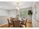 Dining room featuring a round table with seating and a hardwood floor at 835 Navajo Trl, Covington, GA 30016