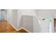 Entryway with hardwood floors and a staircase with white trim at 835 Navajo Trl, Covington, GA 30016