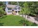Charming two-story home featuring a manicured lawn and attached two-car garage at 835 Navajo Trl, Covington, GA 30016