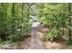 Long driveway through the trees leads to the house at 835 Navajo Trl, Covington, GA 30016