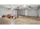 Spacious garage with three car bays and door to the interior at 835 Navajo Trl, Covington, GA 30016