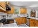 Bright kitchen with granite countertops, stainless steel appliances, and a view of the fireplace at 835 Navajo Trl, Covington, GA 30016