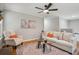 Comfortable living room featuring neutral tones, a cozy armchair, and a decorative area rug at 835 Navajo Trl, Covington, GA 30016