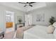 Spacious main bedroom featuring a tray ceiling, and access to the en-suite bathroom and closets at 835 Navajo Trl, Covington, GA 30016