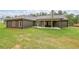 Spacious backyard featuring a covered patio, perfect for outdoor entertaining and relaxation at 96 Lexie Ct, Rockmart, GA 30153