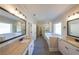 Elegant bathroom with dual sinks, soaking tub, and walk-in closet access at 96 Lexie Ct, Rockmart, GA 30153
