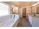 Beautiful bathroom features a soaking tub, dual sinks, and ample natural light at 96 Lexie Ct, Rockmart, GA 30153