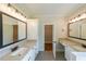Double vanity bathroom with granite countertop, sleek fixtures, and a walk-in closet at 96 Lexie Ct, Rockmart, GA 30153