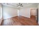 Spacious main bedroom featuring wood-look flooring, a tray ceiling with fan, and neutral walls at 96 Lexie Ct, Rockmart, GA 30153
