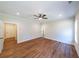 Spacious bedroom with a ceiling fan and two doorways at 96 Lexie Ct, Rockmart, GA 30153