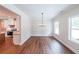 Bright dining room features wood floors, wainscoting and views into the kitchen, creating a seamless flow at 96 Lexie Ct, Rockmart, GA 30153
