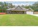 Inviting single-Gathering home with a well-manicured lawn and a charming covered front porch at 96 Lexie Ct, Rockmart, GA 30153