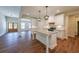 Open-concept kitchen boasts a large island, stainless steel appliances, and abundant natural light at 96 Lexie Ct, Rockmart, GA 30153