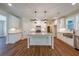 Modern kitchen with a central island, granite countertops, and stainless steel appliances at 96 Lexie Ct, Rockmart, GA 30153