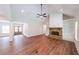 Inviting living room features a stone fireplace, built-in shelving, and a view of the front entrance at 96 Lexie Ct, Rockmart, GA 30153