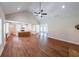 Open concept living space with a kitchen, dining area, and living room with wood-look flooring at 96 Lexie Ct, Rockmart, GA 30153