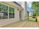 Inviting back porch made of wood and the exterior features siding and a view of the backyard at 1039 Megan Ct, Sugar Hill, GA 30518