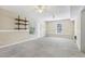 Spacious finished basement with carpet, windows, shelving, and ample room for activities at 1039 Megan Ct, Sugar Hill, GA 30518