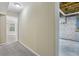 Basement hallway with finished and unfinished areas, offering potential for storage or customization at 1039 Megan Ct, Sugar Hill, GA 30518