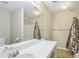 Bathroom with a shower/tub, vanity with storage, and a neutral color scheme at 1039 Megan Ct, Sugar Hill, GA 30518