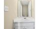 Bright bathroom with a large mirror and a white vanity providing ample counter space at 1039 Megan Ct, Sugar Hill, GA 30518
